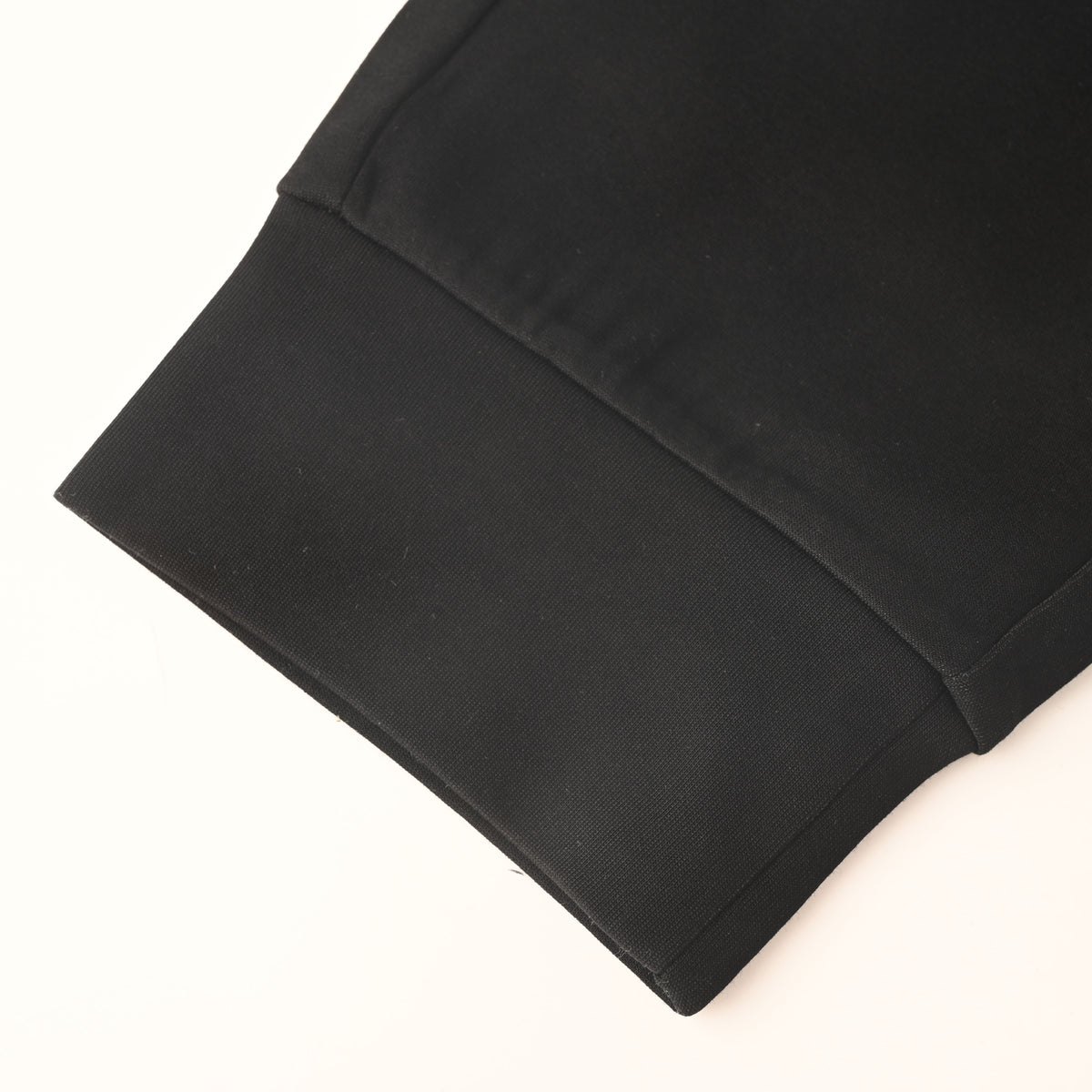 PRADA Black Logo-Panel Tapered Joggers with Red Pocket Detail