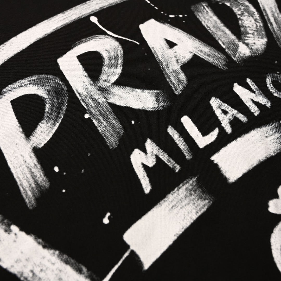 Prada Paint-Splatter Logo Oversized Cotton Long Sleeve T-Shirt